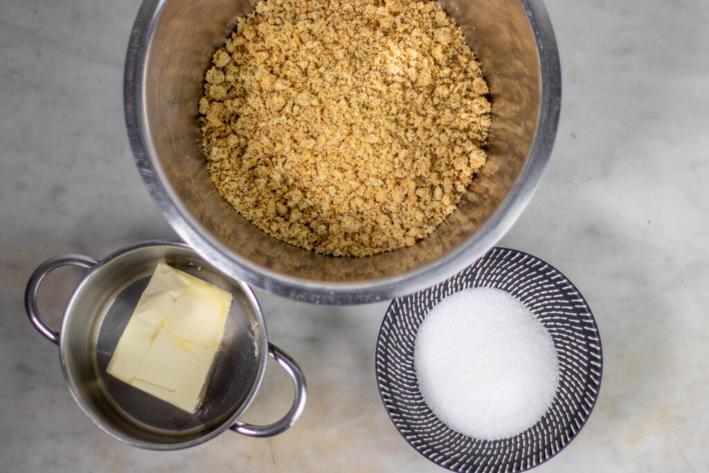 1. The ingredients for the cookie crust. The vegan butter is melted and then everything is kneaded.