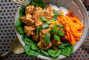 Tofu in peanut sauce with vegetables on rice