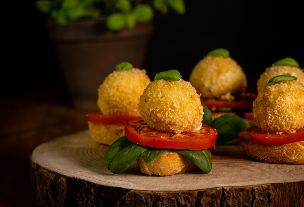 Fried mozzarella balls – served on bread with tomato and basil