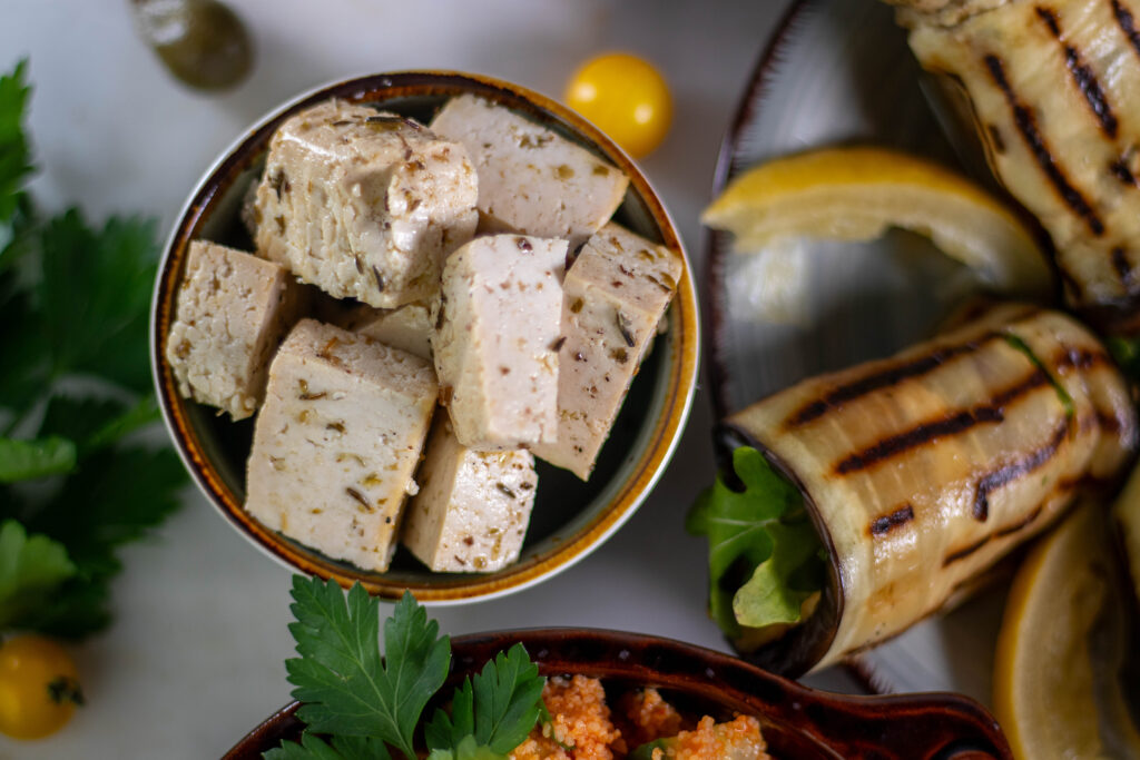 Fresh, homemade, vegan feta as part of a mezze board