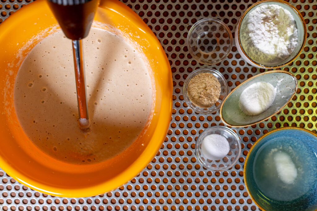 2. Puree the soaked cashews with the aquafaba and soy milk.