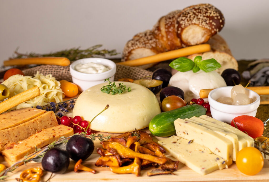 Cheese boards, a perfect snack for cozy gatherings. Here with various potato cheeses and vegan mozzarella.