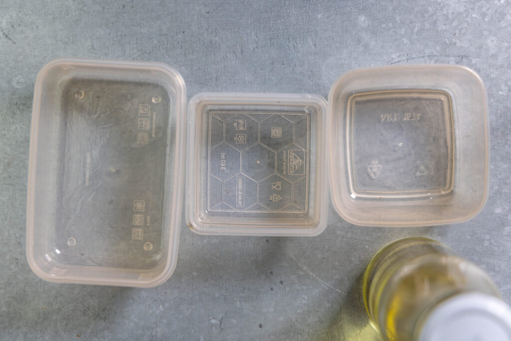 3. Lightly oil small plastic containers.