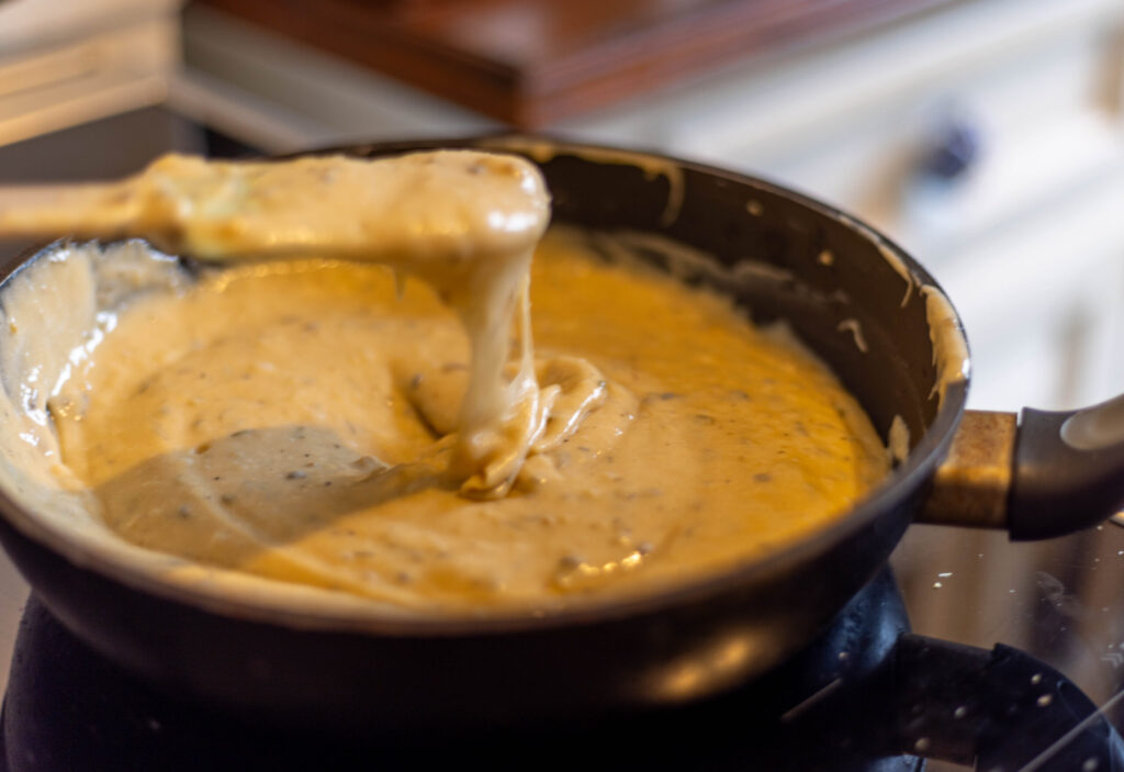 6. Heat the vegan cheese mixture slowly. It should be close to boiling for a while.