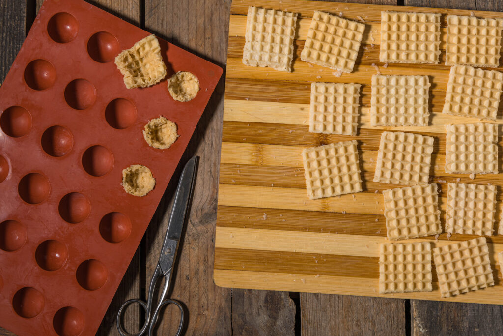 Waffles are pressed into the silicone molds.